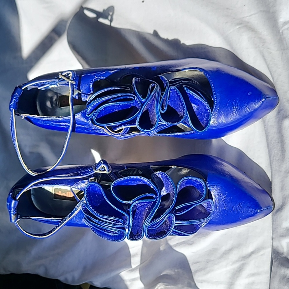 Dollhouse Vibrant Blue Ruffle Bow High Heel Pumps are beautiful shoes very odd.
